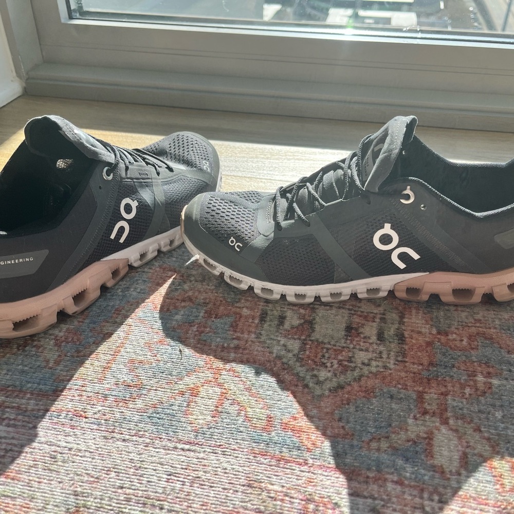 On Running Black and Pink Sneakers with Cloud-Like Sole